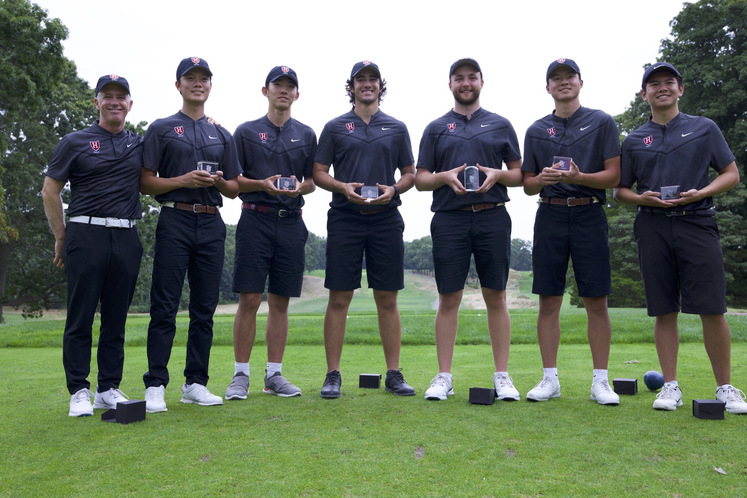 The men's golf team poses after a tournament.