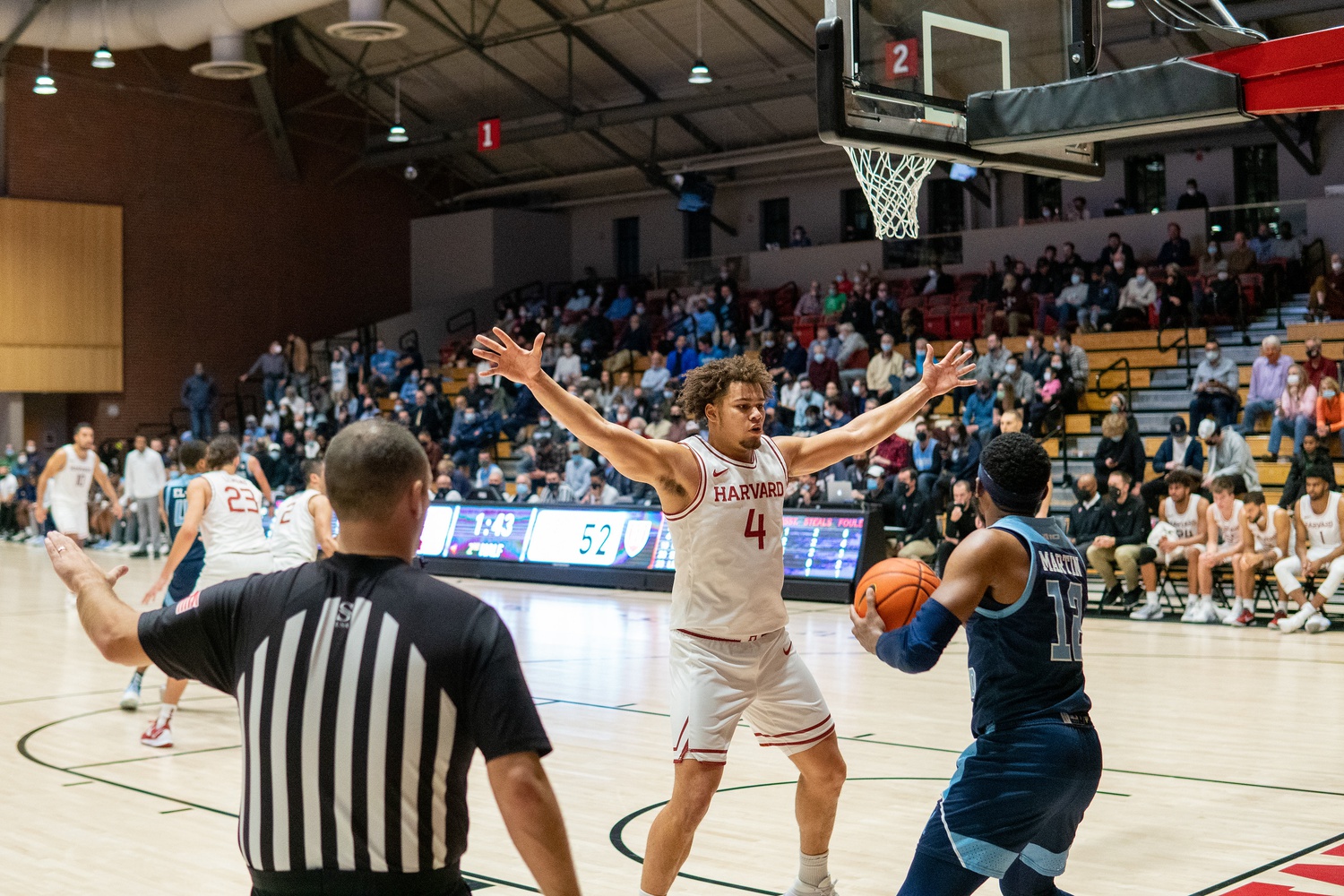 Then-junior forward Chris Ledlum guards in last December's matchup with URI.