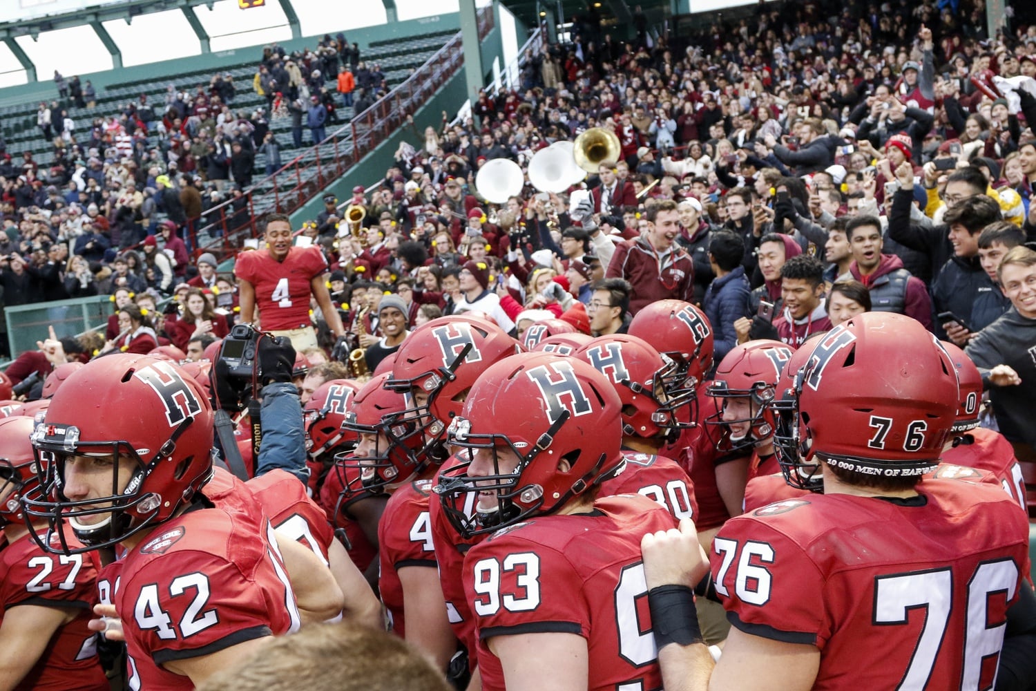 The Harvard football team hypes itself up before a 45-27 victory over Yale on Nov. 17, 2018 at Fenway Park. The game turned out to be an unforgettable affair.