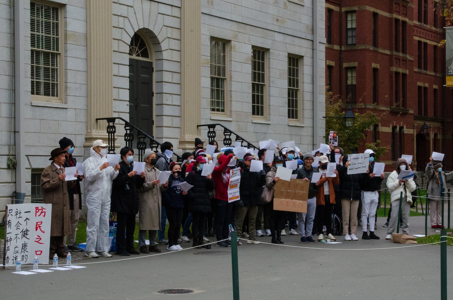 Demonstrators gathered outside University Hall on Tuesday to protest the Chinese government's handling of Covid-19.