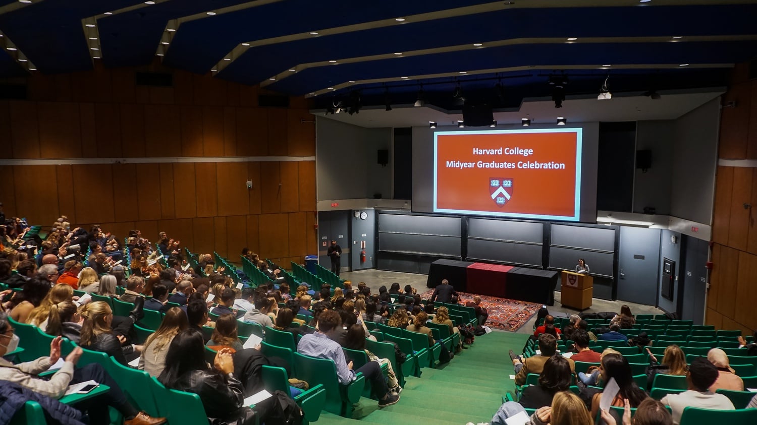Offcycle Harvard students gather in the Science Center B lecture alongside friends and family for the Midyear Graduation Ceremony and celebration.