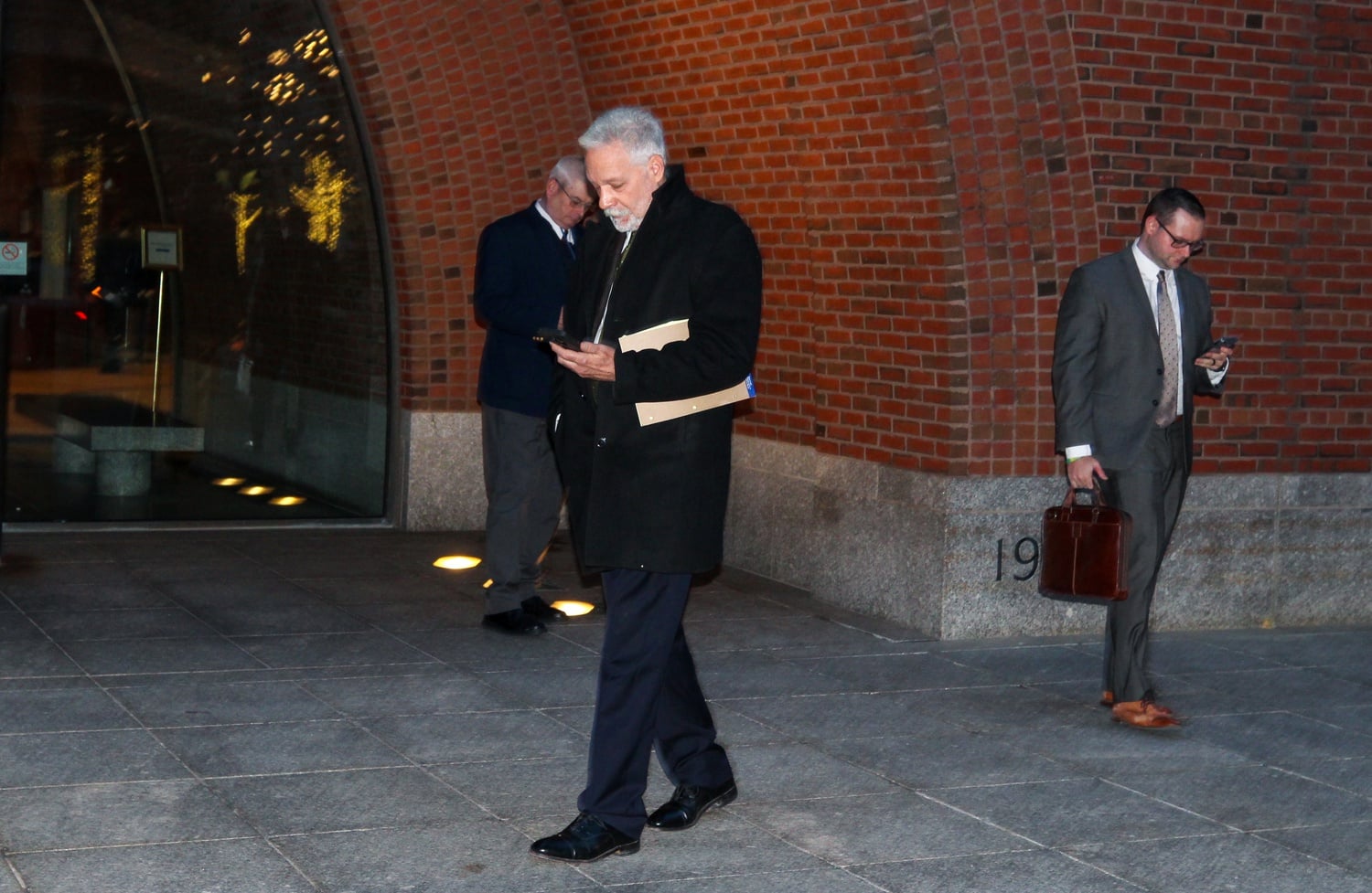 Former Harvard fencing coach Peter Brand stands outside the John Joseph Moakley United States Courthouse on Tuesday.