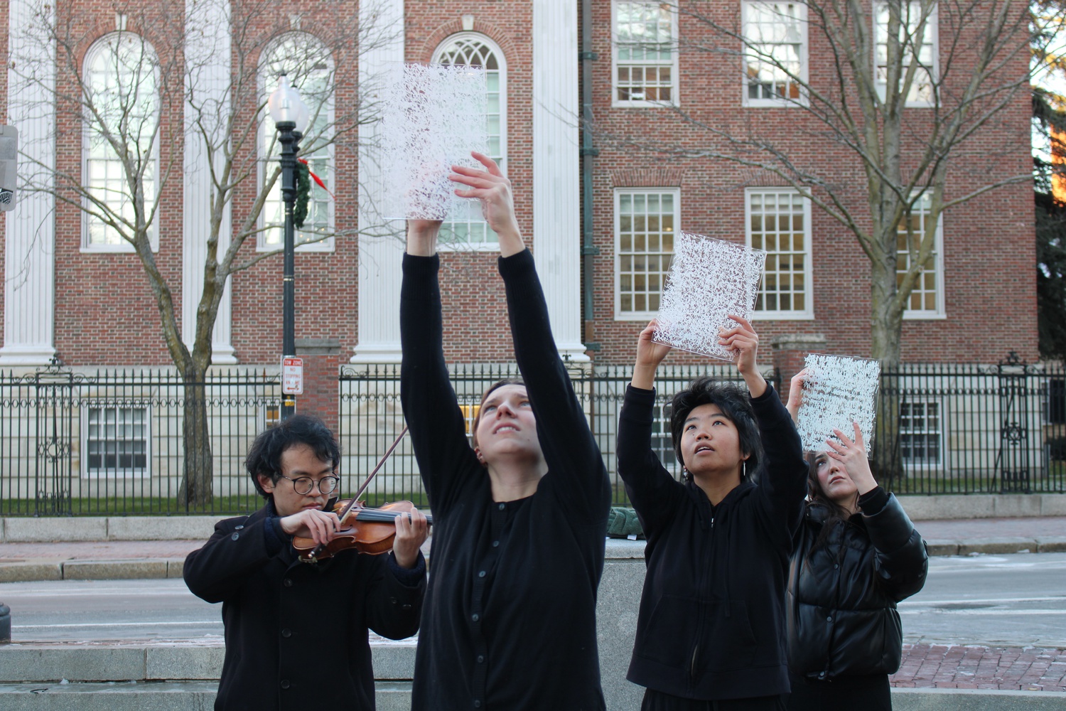Artist Yolanda He Yang and Boston University students Rachel Kanter and Rowan J. Benz cover glass with the phrase "You know what I want to say" to mimic the blank sheets of paper used in recent protests against Chinese censorship.