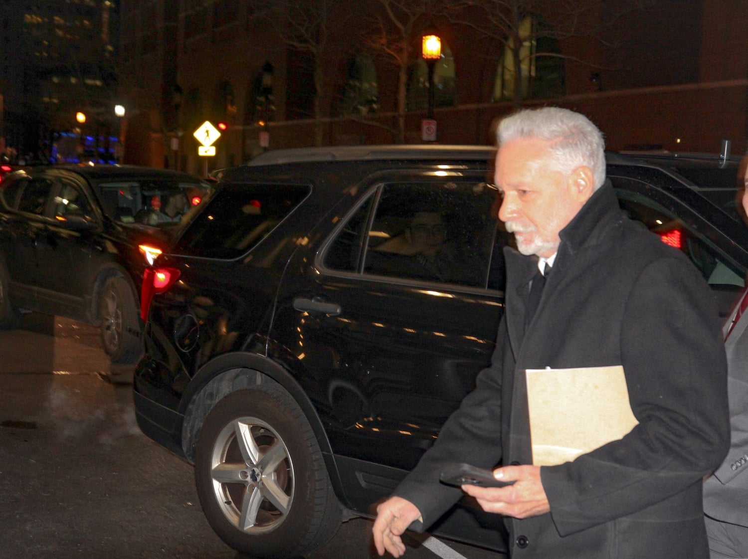 Peter Brand leaves John Joseph Moakley Courthouse, with jurors set to begin deliberations the following day.