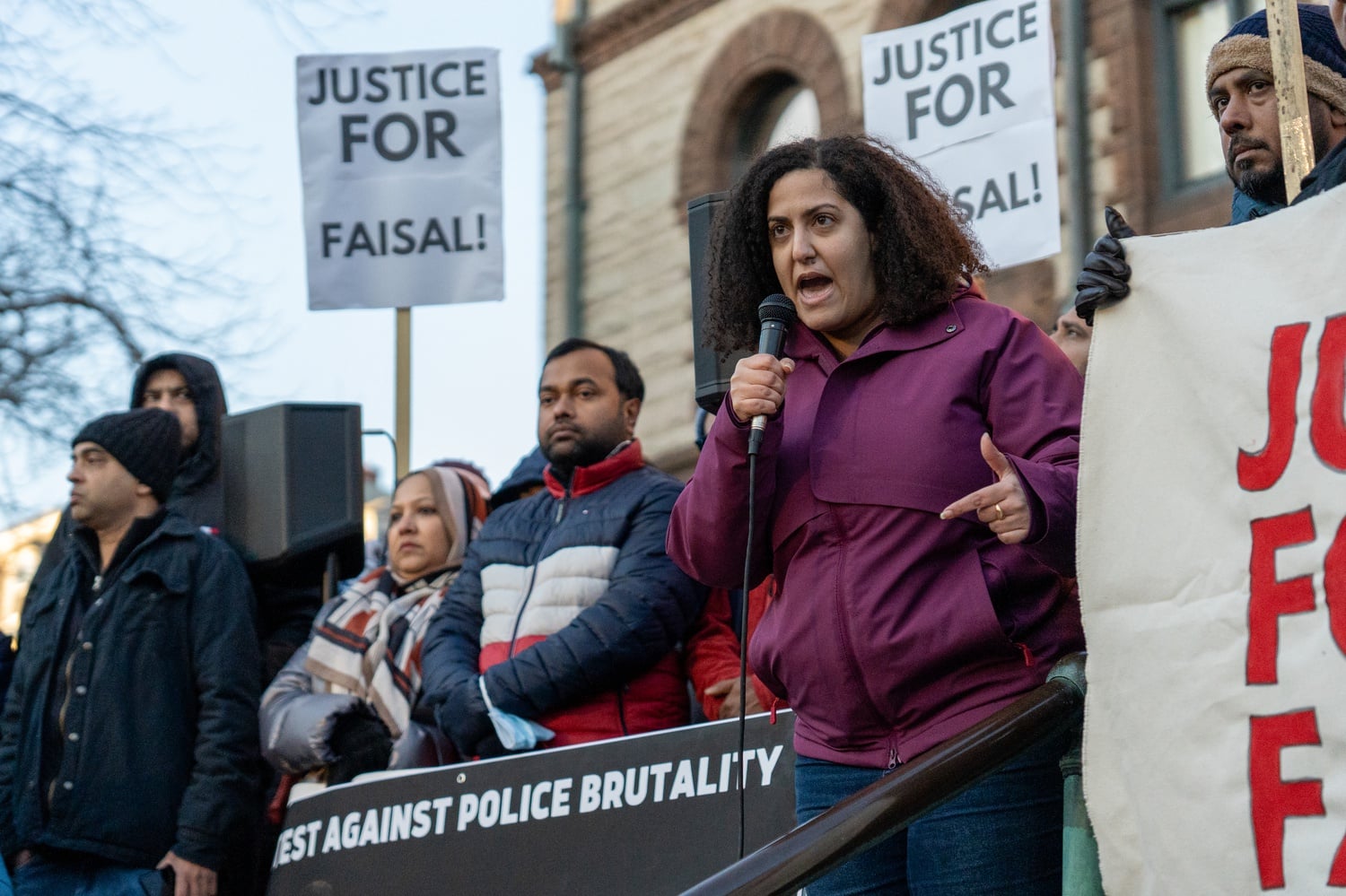 Fatema Ahmad, who is the executive director of the Muslim Justice League, spoke to protestors outside of Cambridge City Hall during a Monday protest over the police shooting of Sayed Faisal.