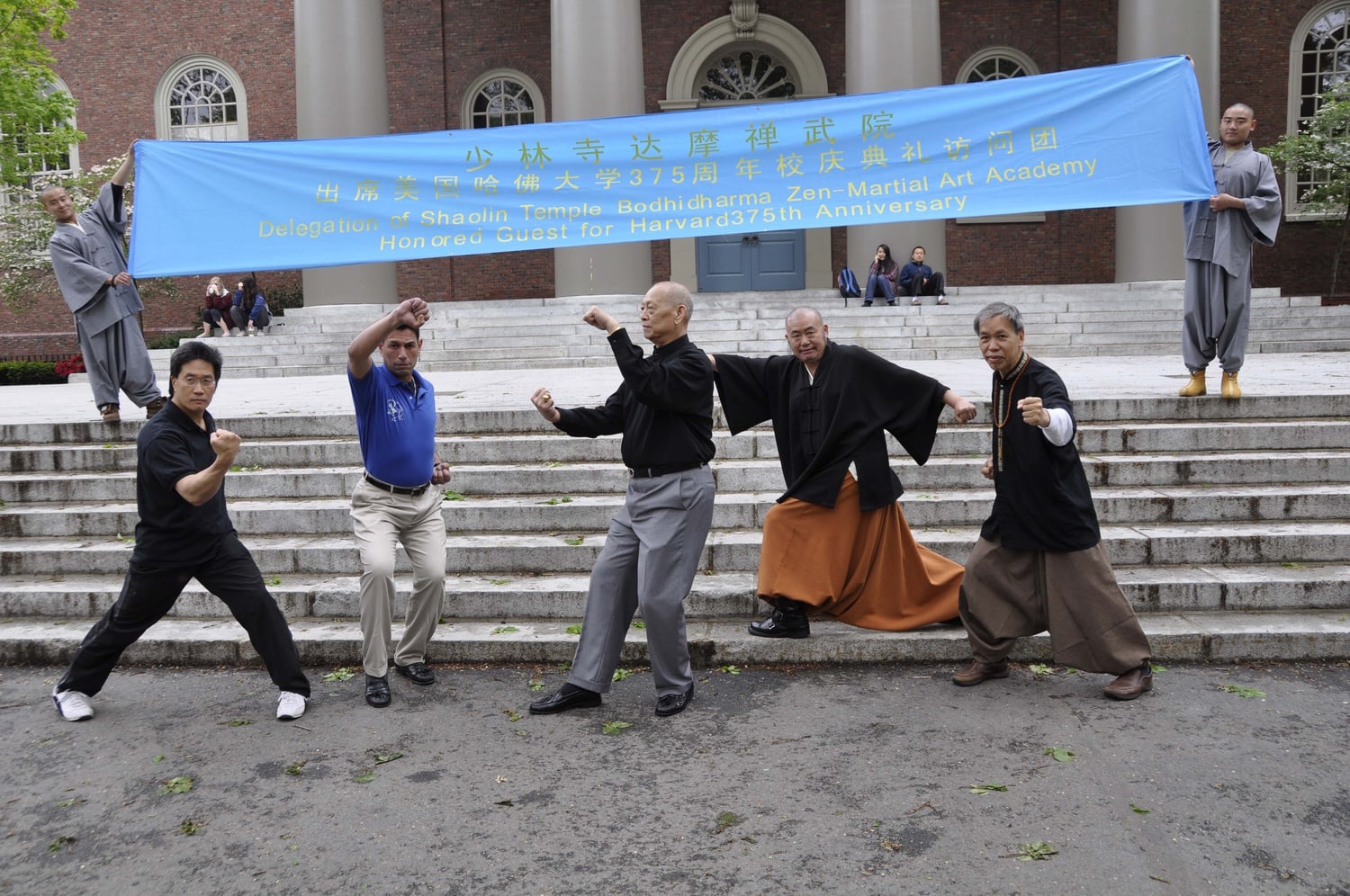 Lee, right, launched an annual exchange program between Harvard students and the Shaolin Temple in Dengfeng, China.