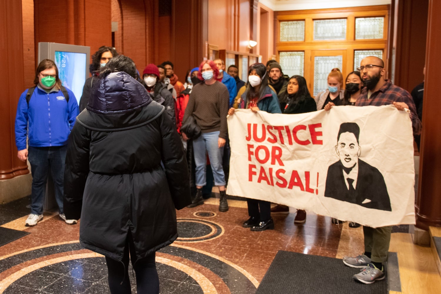 Protesters entered Cambridge City Hall on Jan. 23 to confront Cambridge Mayor Sumbul Siddiqui, demanding she release the names of officers involved in the killing of Sayed Faisal.