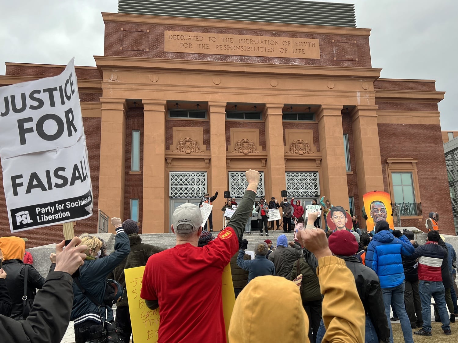 Protesters gather in front of Somerville High School at a protest after the fatal shooting of Cambridge resident Sayed Faisal by a Cambridge Police Department officer on Jan. 4.
