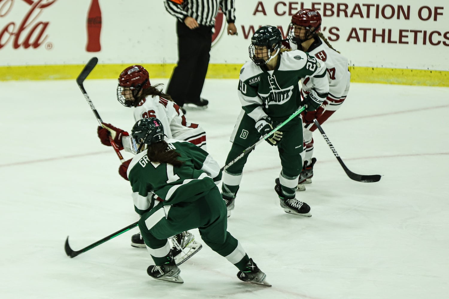 The Crimson and the Big Green hunt for the puck on October 21, 2022.
