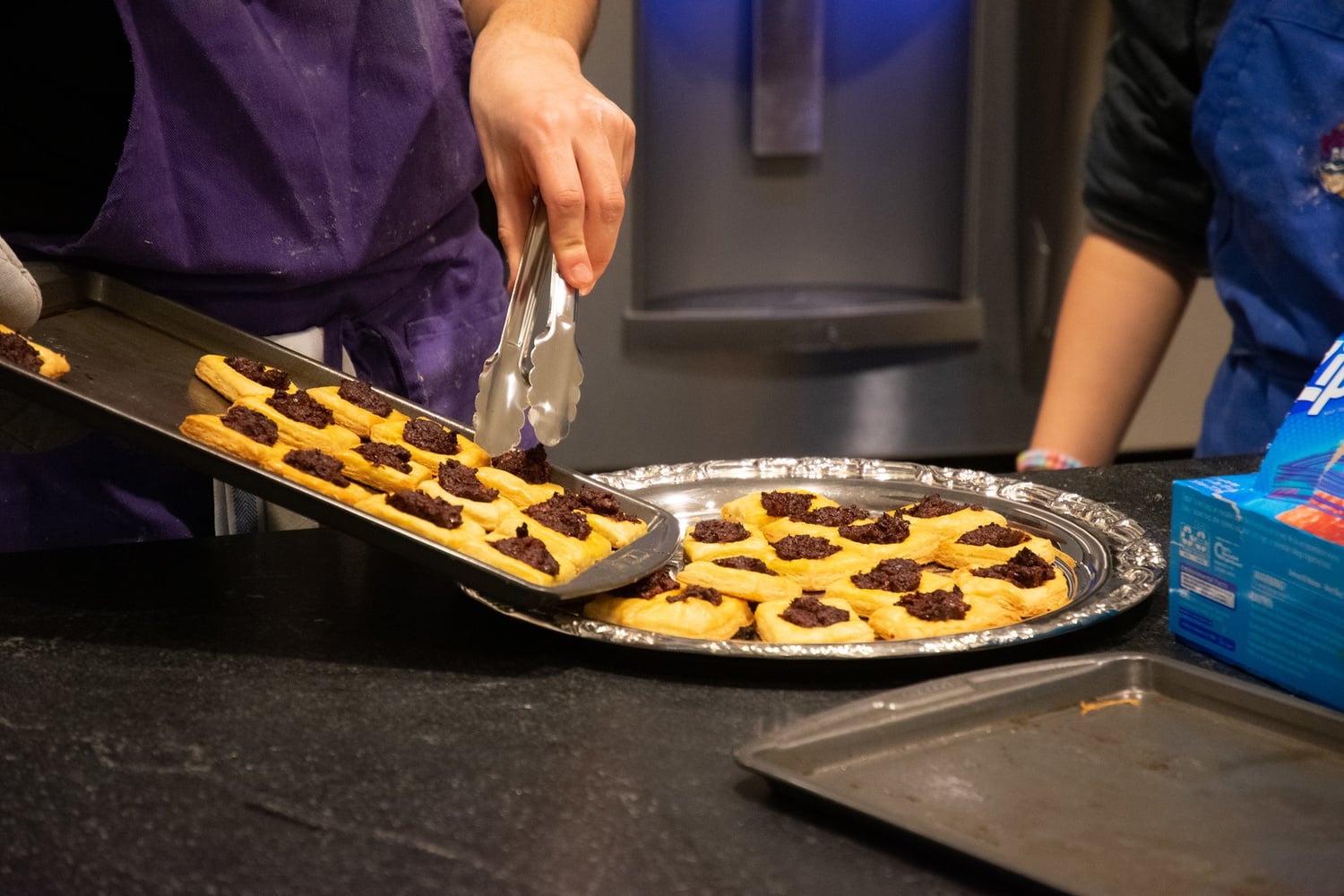 Connor Chung ’23 plates his olive tapenade danishes.