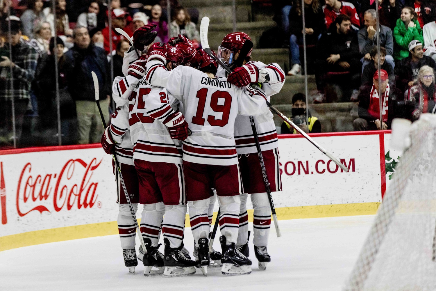 The Harvard power play unit celebrates a goal against Cornell on January 28th. The Crimson power play recorded two goals on Friday against Dartmouth.
