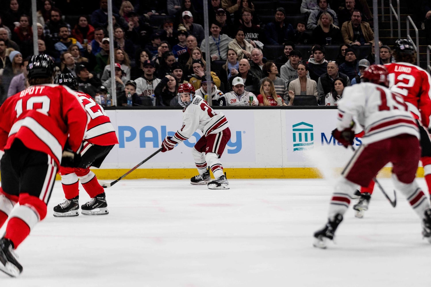 Junior forward Sean Farrell looks for a passing lane in the Beanpot title game on Monday night. Farrell is the Crimson's leading scorer on the season.