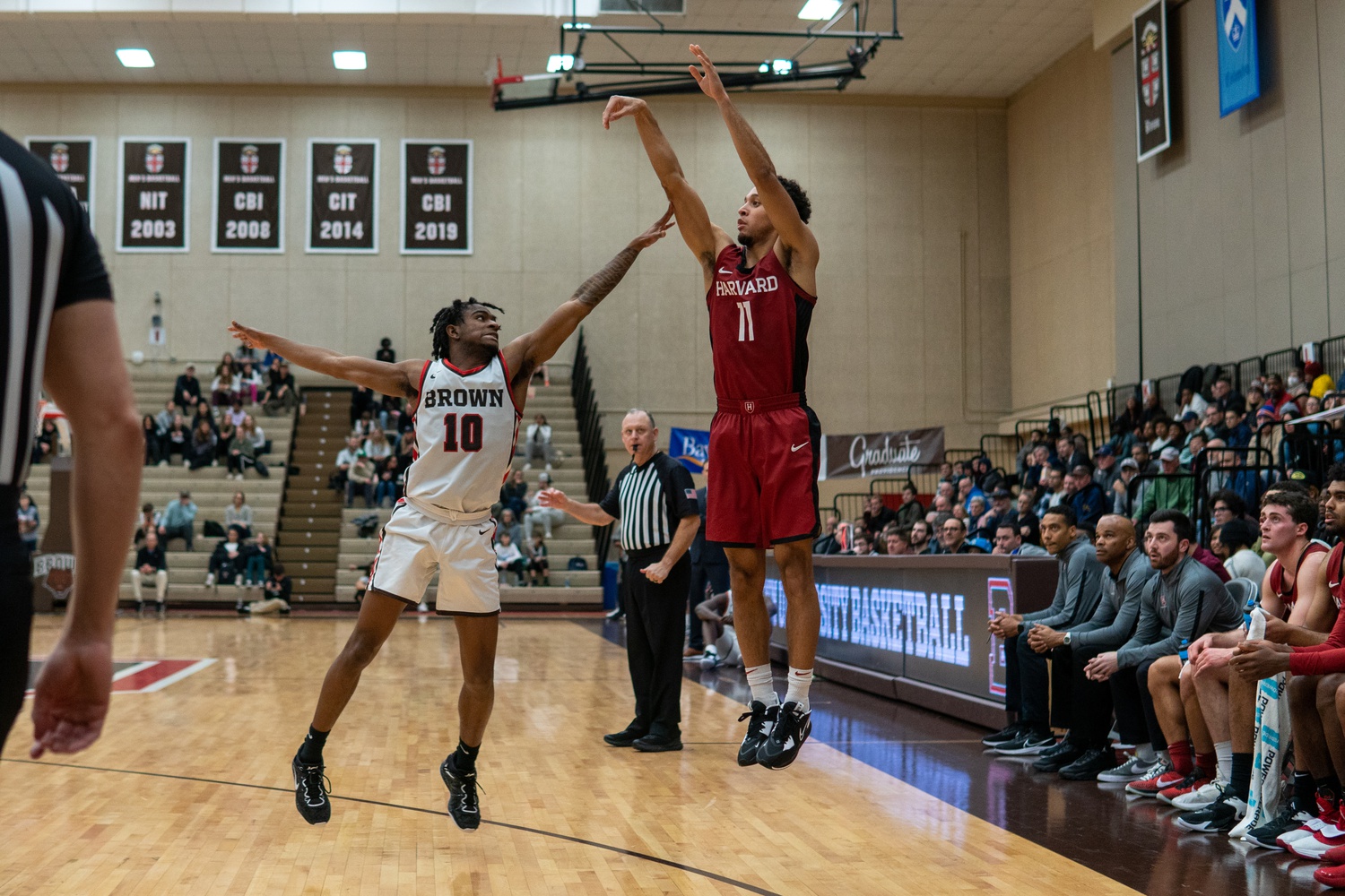 Sophomore guard Evan Nelson shoots for a three-pointer at an away game against Brown on January 6. The Crimson beat the Bears 70-68 in overtime, despite recently losing in a close 68-65 game at Lavietes Pavillion on February 4.