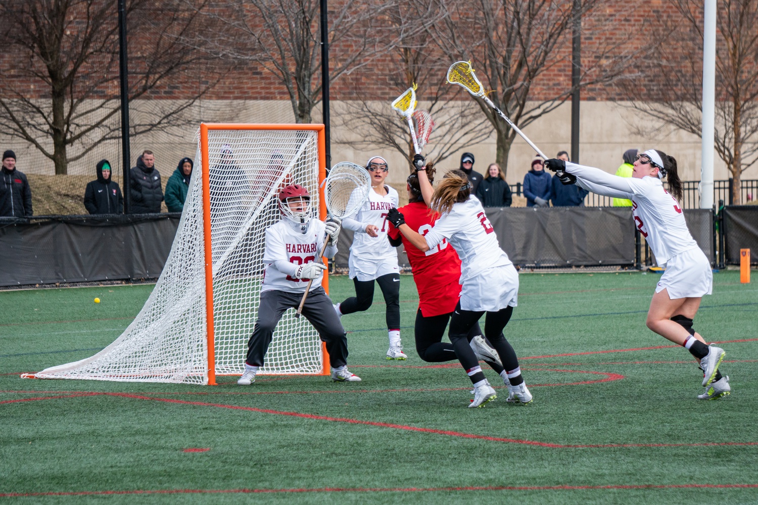 The Crimson defense swarms the Cornell Big Red on February 29, 2020.