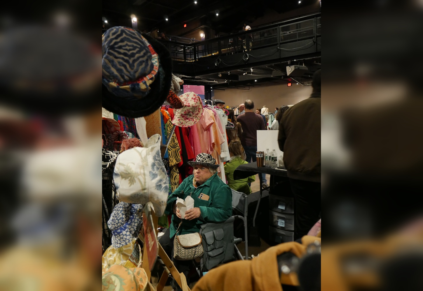 Annie Gauger sitting behind her booth, Annie Wears.