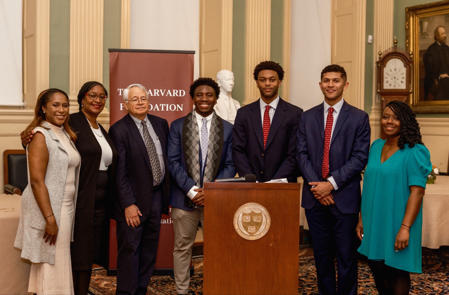 The Harvard Foundation will unveil a portrait of Lucien V. Alexis Jr. later this year. From left to right: Sadé Abraham, Harvard Foundation senior director; Brenda D. Tindal, FAS chief campus curator; Stephen Coit '71, artist for the Harvard Foundation portraiture project; Fred K. Asare-Konadu ’24; Jaden B. Jernigan ’24; Isaiah Dawson ’23; and Alta Mauro, Harvard College associate dean for inclusion and belonging.