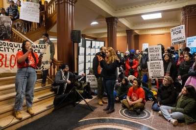 Cover image for Protesters Condemn City Manager, Renew Calls to Name Officers Involved in Killing of Sayed Faisal