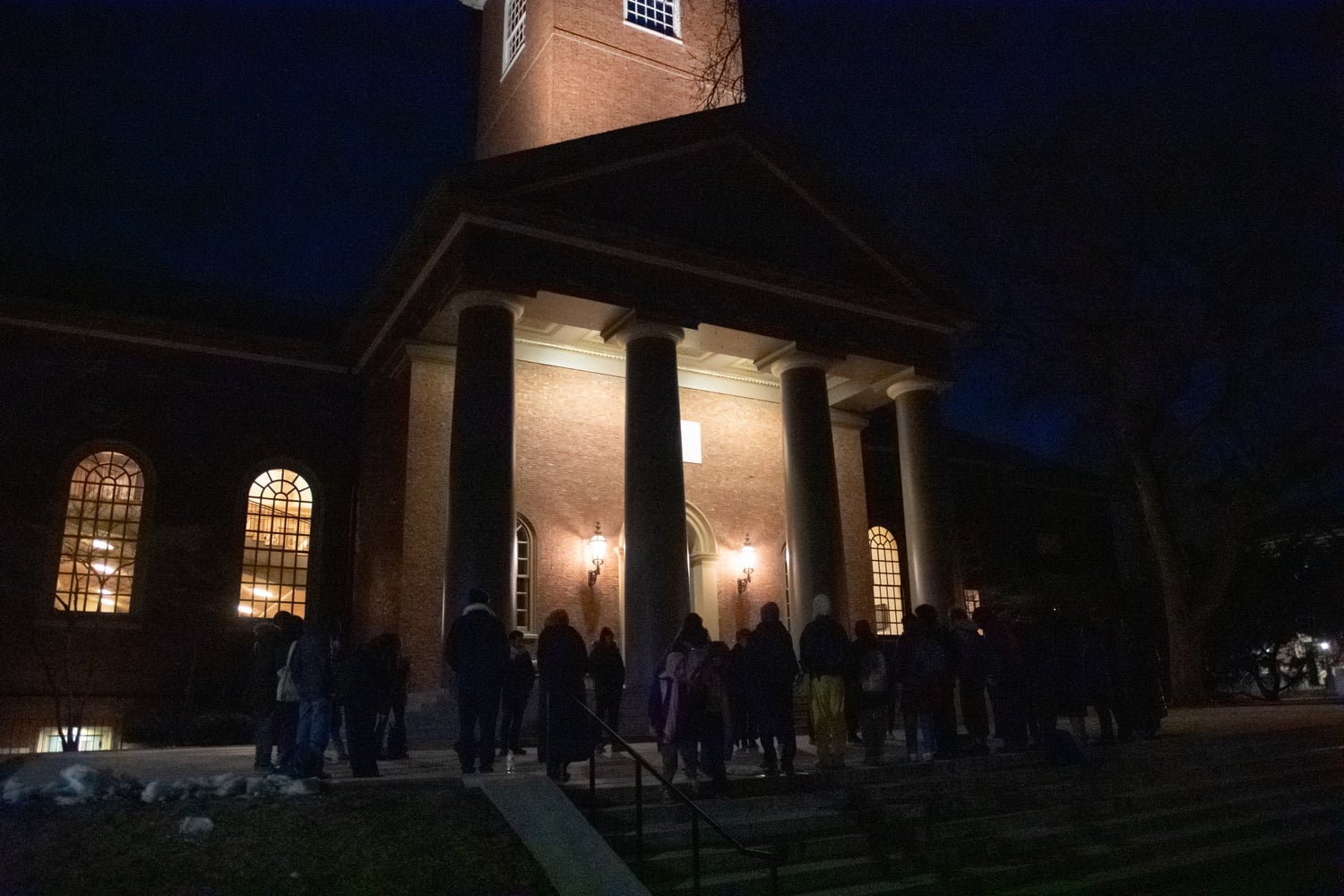 Dozens of Harvard affiliates gathered in front of Memorial Church Sunday evening for a vigil to mourn Palestinian lives lost in the Israeli-Palestinian conflict.
