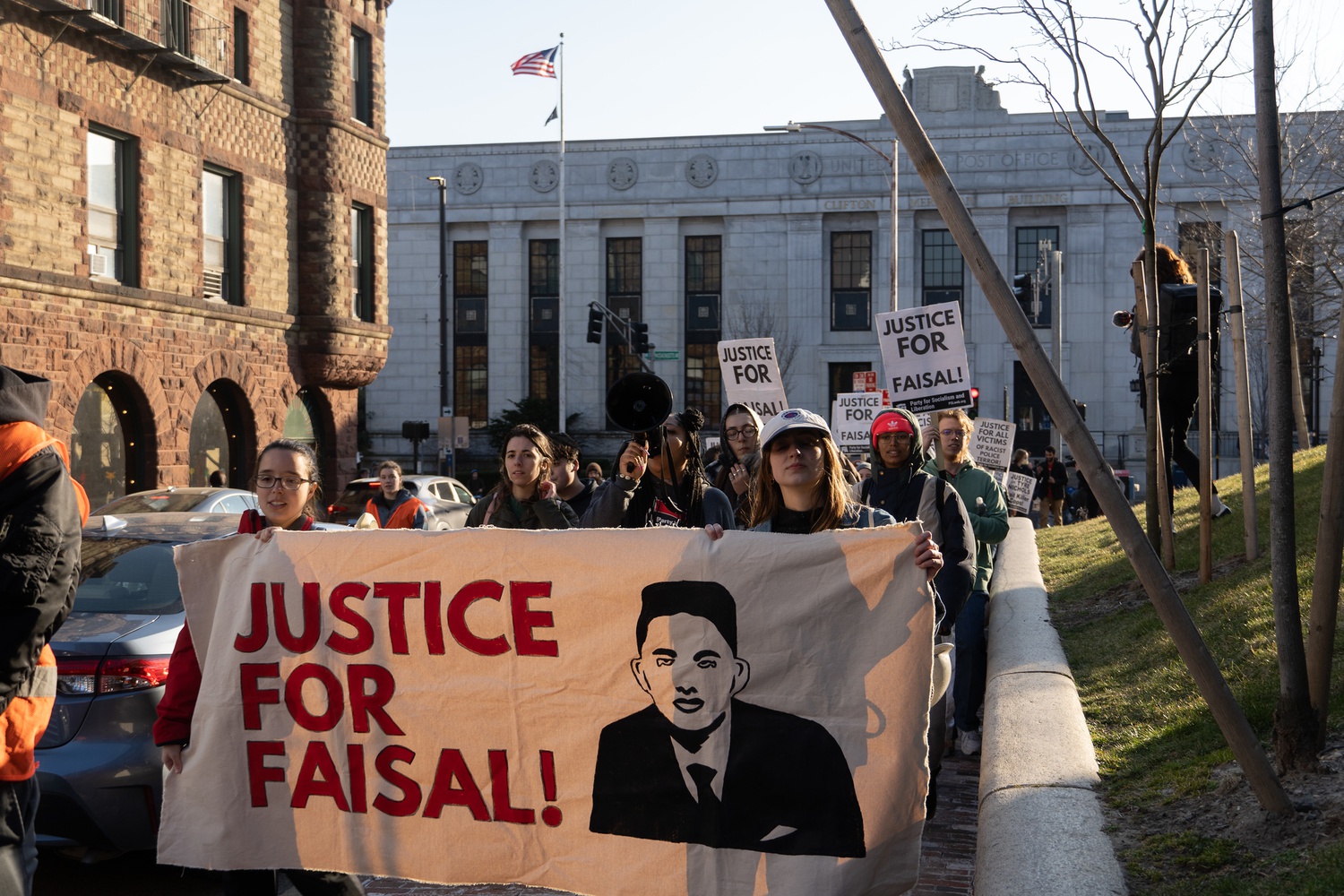 The protest began at City Hall as a continuation of another rally protesting the killing of Sayed Faisal Monday.