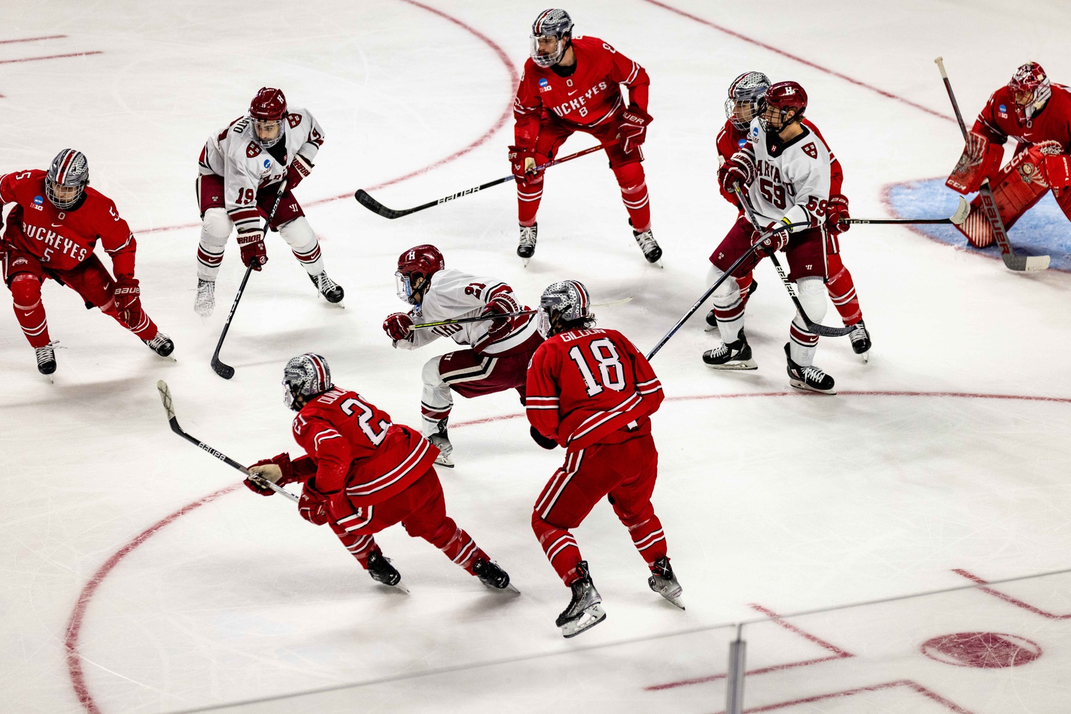 Harvard's top line of Sean Farrell, Matthew Coronato, and Zakary Karpa looks for space against Ohio State at the NCAA Bridgeport Regional on March 24.