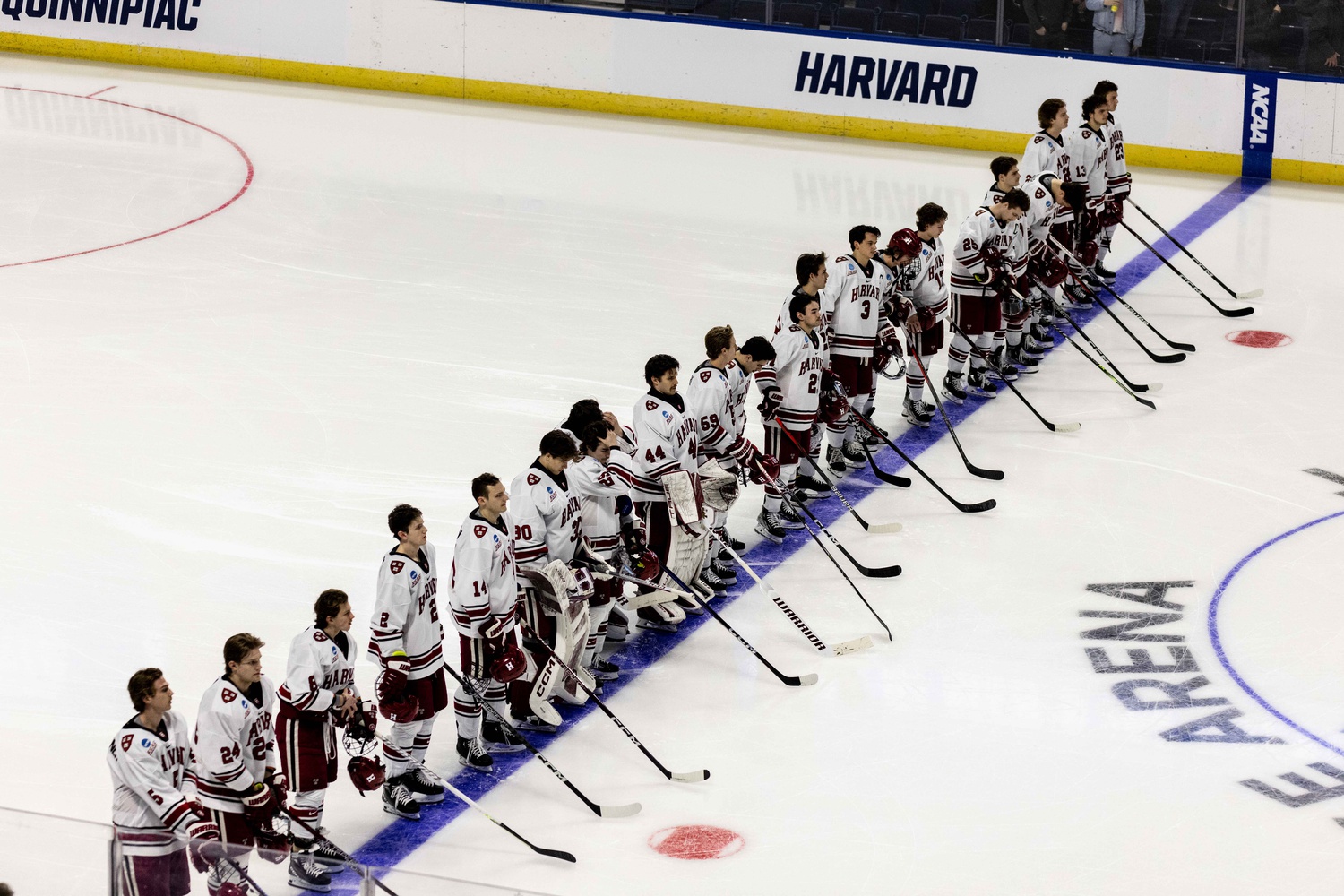 Harvard stands on the blue line during the playing of the national anthem at the NCAA Bridgeport Regional on March 24.