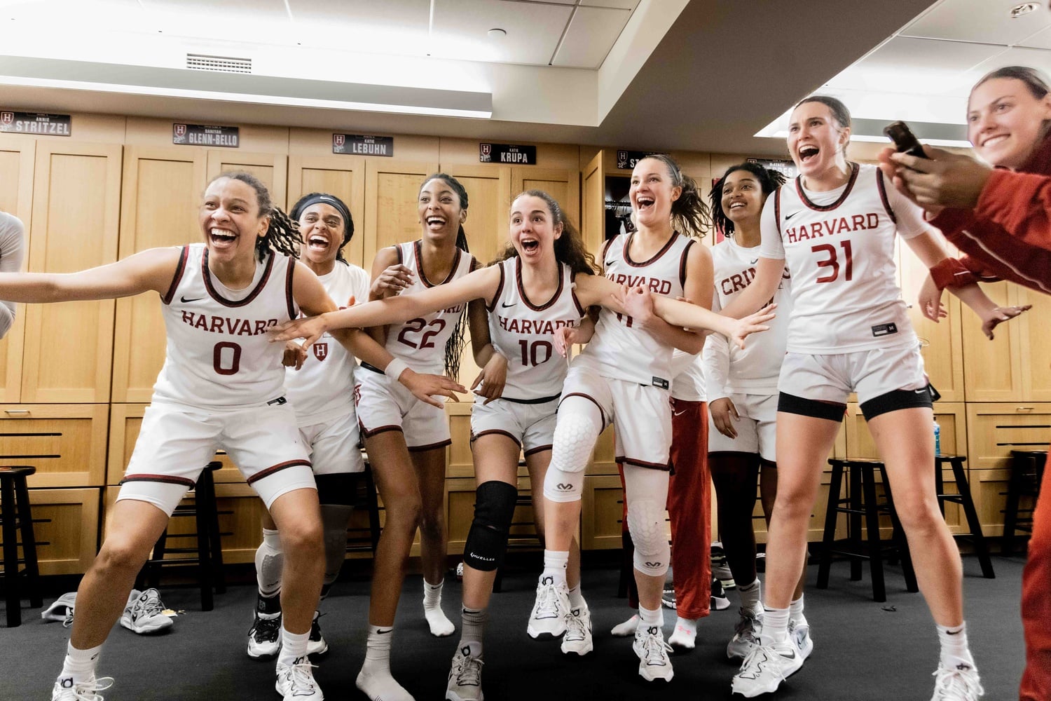 The Harvard women's basketball team celebrates its 74-63 victory over the University of Rhode Island on March 23 at Lavietes Pavilion, sending the Crimson to the quarterfinal match of the 2023 NCAA WNIT. Harvard went on to lose against Columbia in a 77-71 battle on March 26.