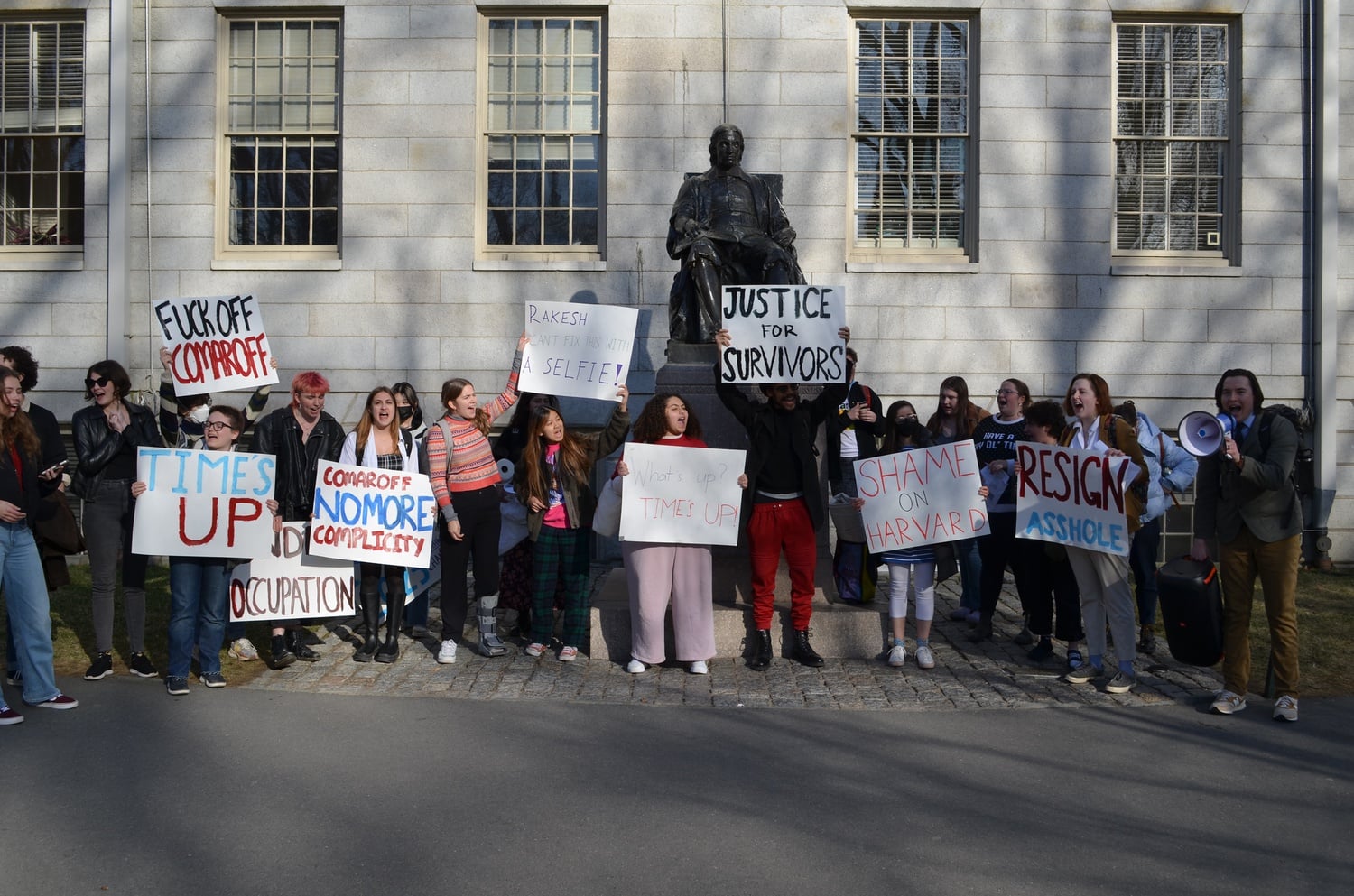 Students held signs and chanted outside University Hall following an hourslong occupation of the building.