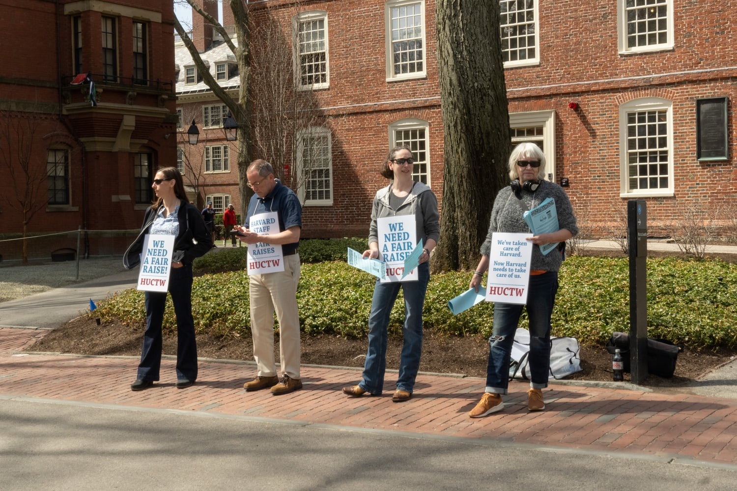 Members of the Harvard Union of Clerical and Technical Workers have protested the Faculty of Arts and Sciences plan to lay off up to a quarter of its staff this summer.