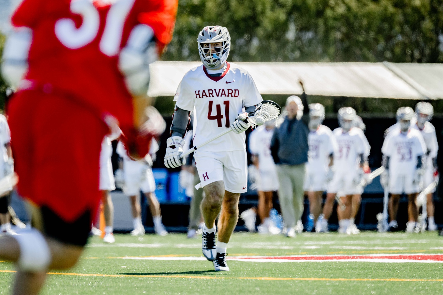 Sophomore middie Andrew Perry runs with the ball in Harvard's game against Cornell last Saturday. Perry was an instrumental player, locking in four points with three goals and one assist in the game.