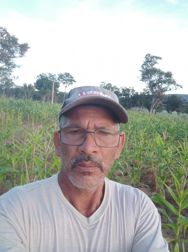 João Pereira Mendes stands in front of a field.