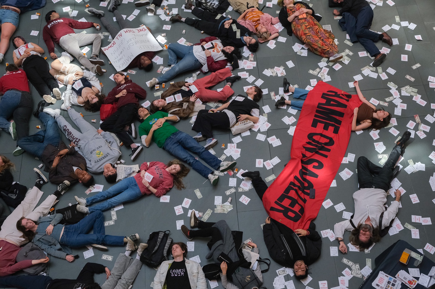Dozens of Harvard students staged a "die-in" at the Harvard Art Museums on Thursday to protest the University's ties to Arthur M. Sackler and his family.