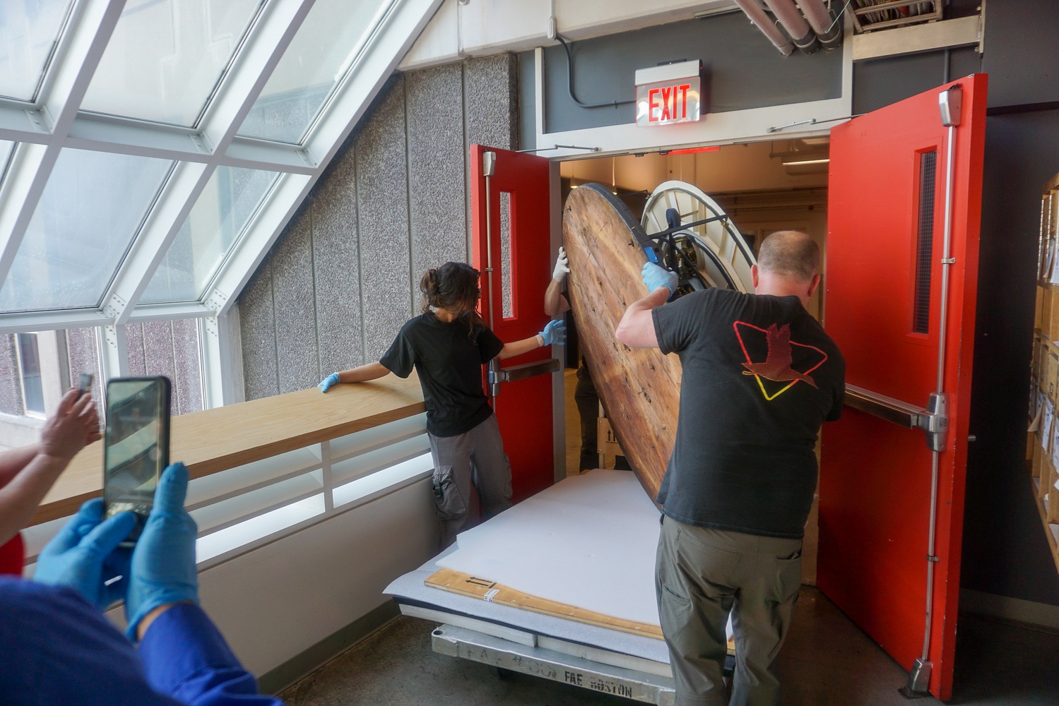 The Grand Orrery had to be turned on its side to fit through a door frame before being transported down a freight elevator and into the Putnam Gallery for display.