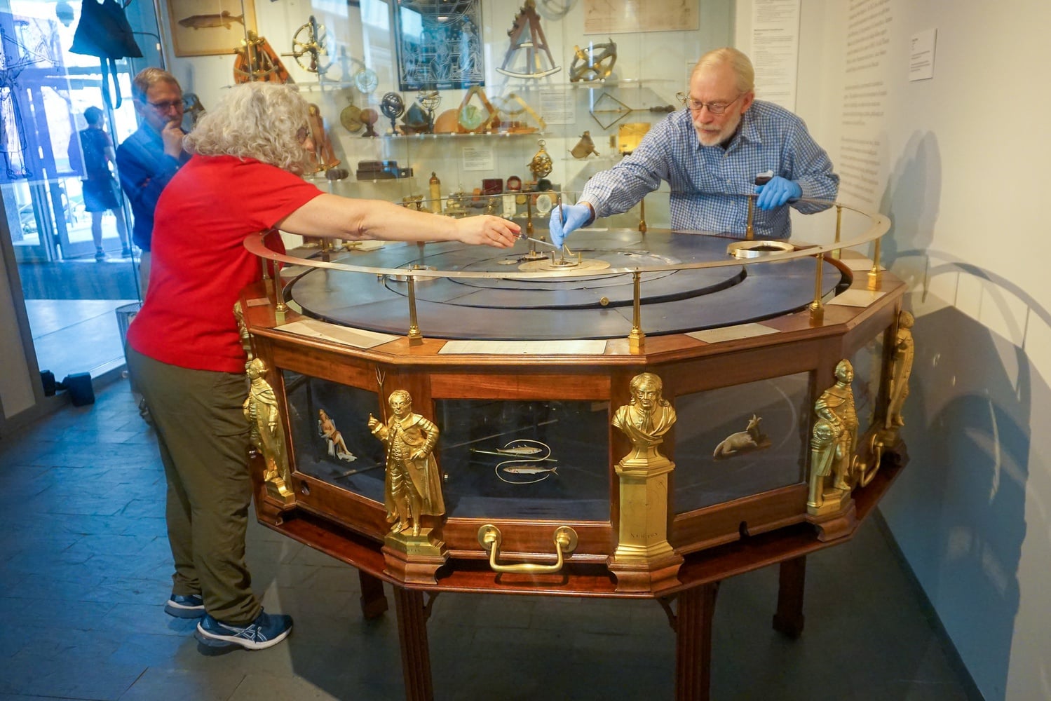 Harvard acquired its Grand Orrery in 1789, two years after it was built by Boston clockmaker Joseph Pope. The device is an intricately crafted working model of the solar system made of brass, mahogany, ivory, and glass, complete with once-revolving planets, all encased under a glass dome adorned with stars.