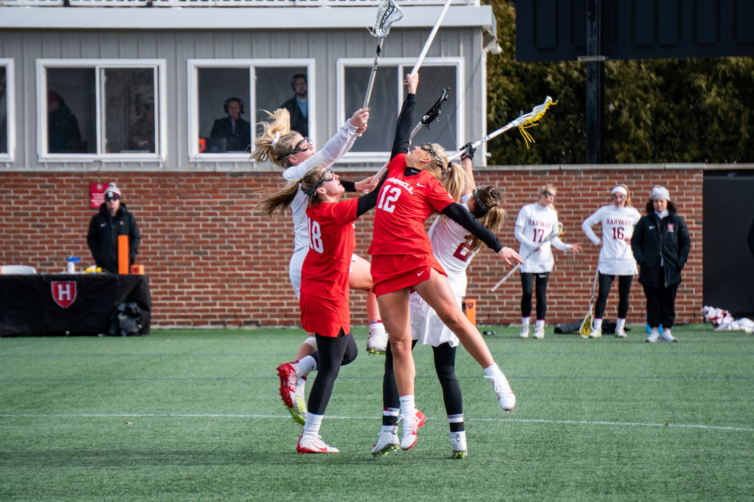 The Crimson and the Cornell Big Red fight for possession on February 29, 2020.