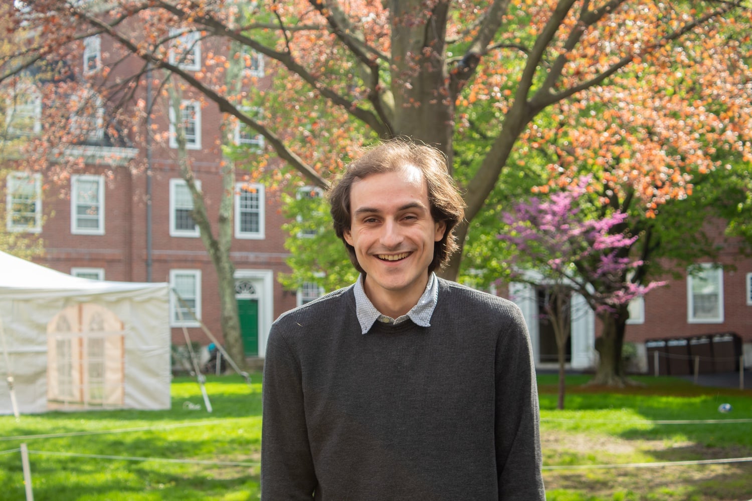 Sam Dvorak in the courtyard of his own house, Eliot. Sam is a senior who just directed his last show for HRDC, "Natasha, Pierre and the Great Comet of 1812".
