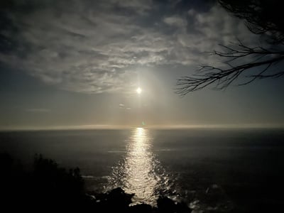 Cover image for The full moon over the Pacific Ocean on Australia’s Sapphire Coast.
