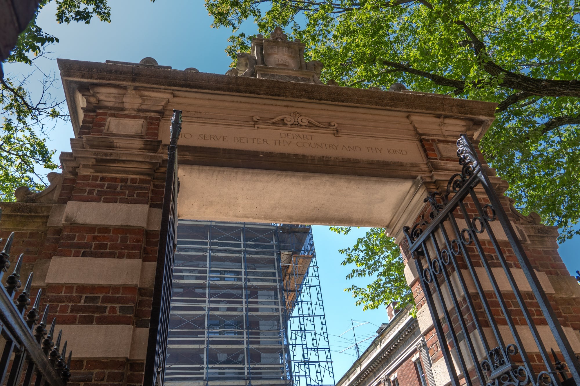 Harvard's Dexter Gate stands at the precipice of Harvard Yard. It was christened in 1890 with an inscription championing public service from then-University President Charles W. Eliot, Class of 1852.