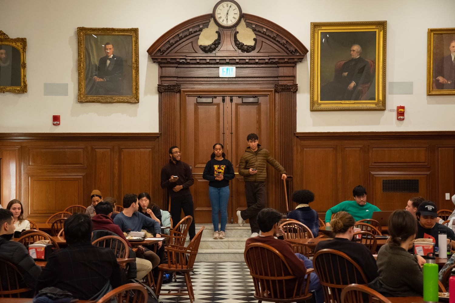 Clyve Lawrence '25, Kiersten B. Hash '25, and Jordan Young '25 speak during a February demonstration to dename Winthrop House.