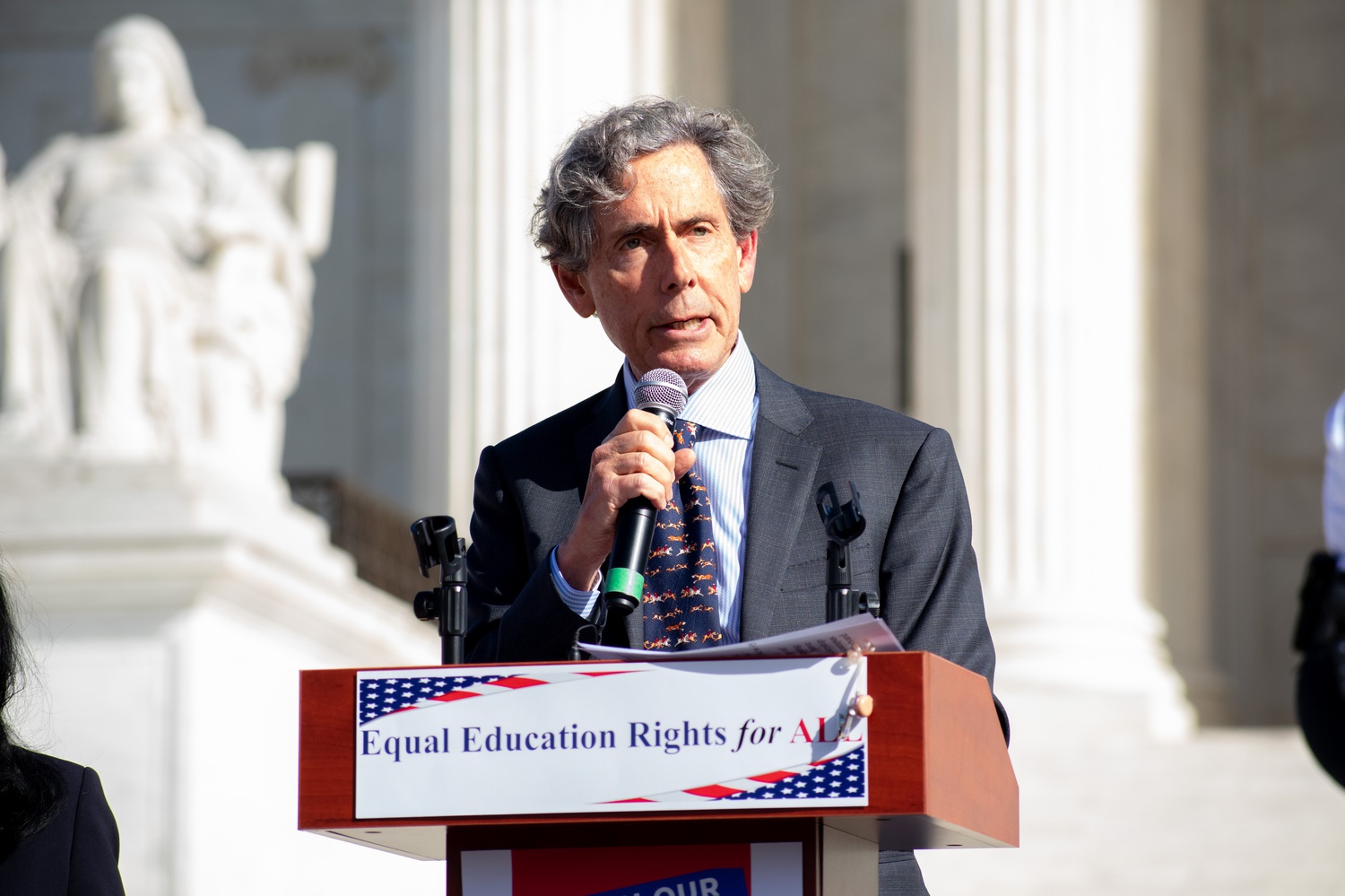 Edward J. Blum, founder of anti-affirmative group Students for Fair Admissions, speaks in front of the Supreme Court. Blum sent a letter to 150 schools demanding compliance with the Supreme Court's decision effectively striking down race-conscious college admissions.