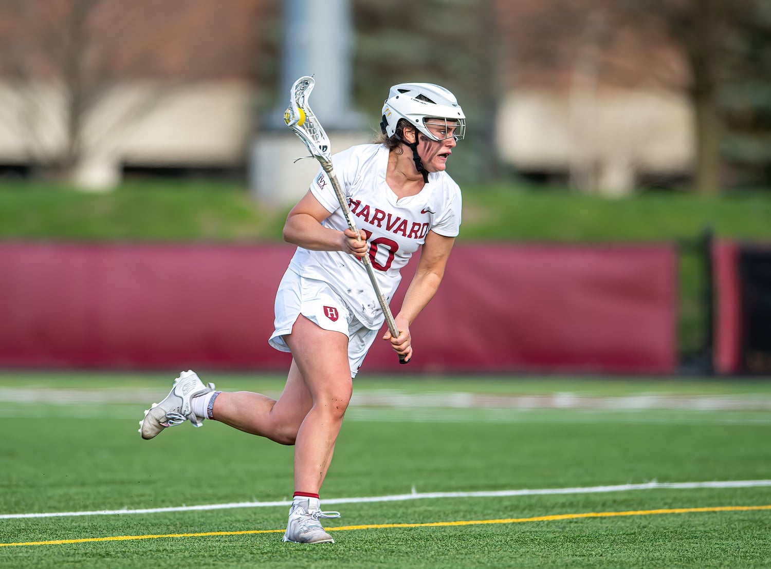 Taylor drives the ball up the field at the Crimson's 10-9 defeat of Yale on April 15, where Taylor recorded turnovers for Harvard.