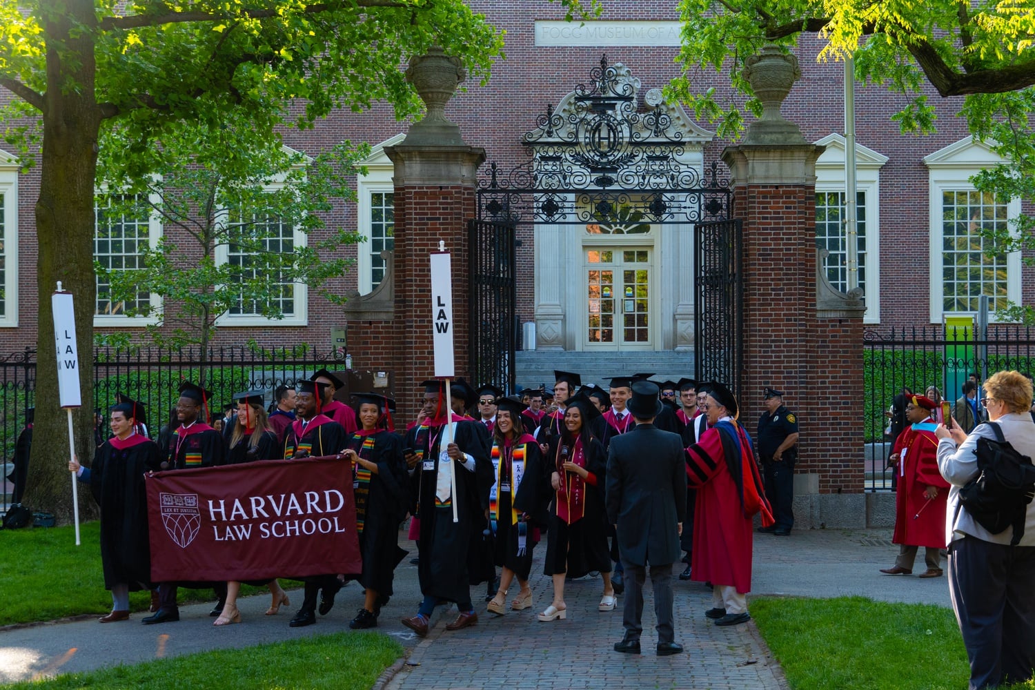 Graduating Harvard Law School students process toward Tercentenary Theatre ahead of the Commencement ceremony.