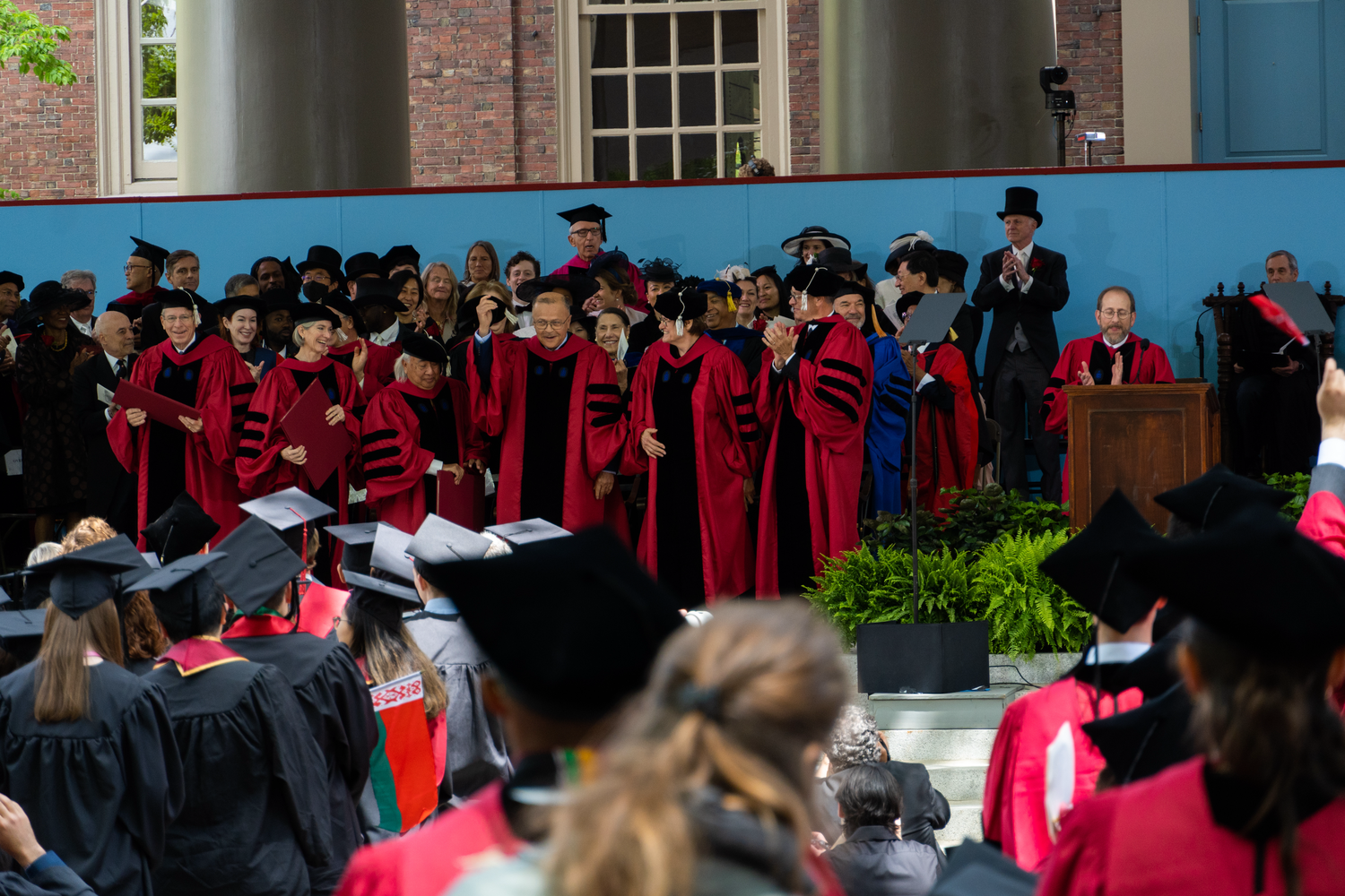 After University President Lawrence S. Bacow conferred a doctorate of laws on historian David Levering Lewis Thursday, the crowd sang “Happy Birthday” to Lewis.