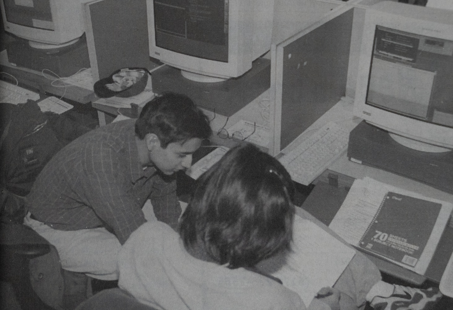 A pair of students study in the library during finals in 1997. Online educational tools transformed academics at Harvard.