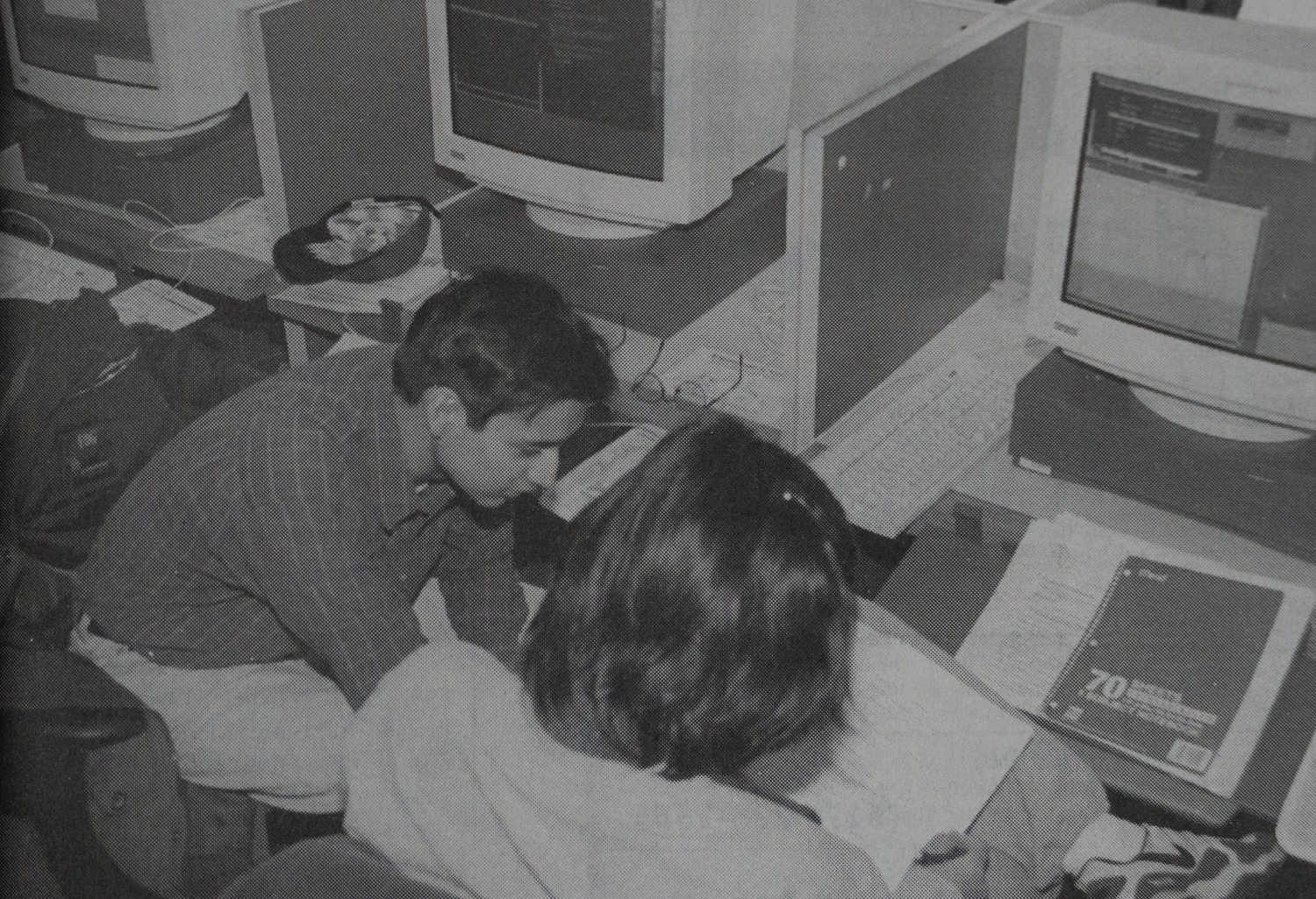 A pair of students study in the library during finals in 1997. Online educational tools transformed academics at Harvard.