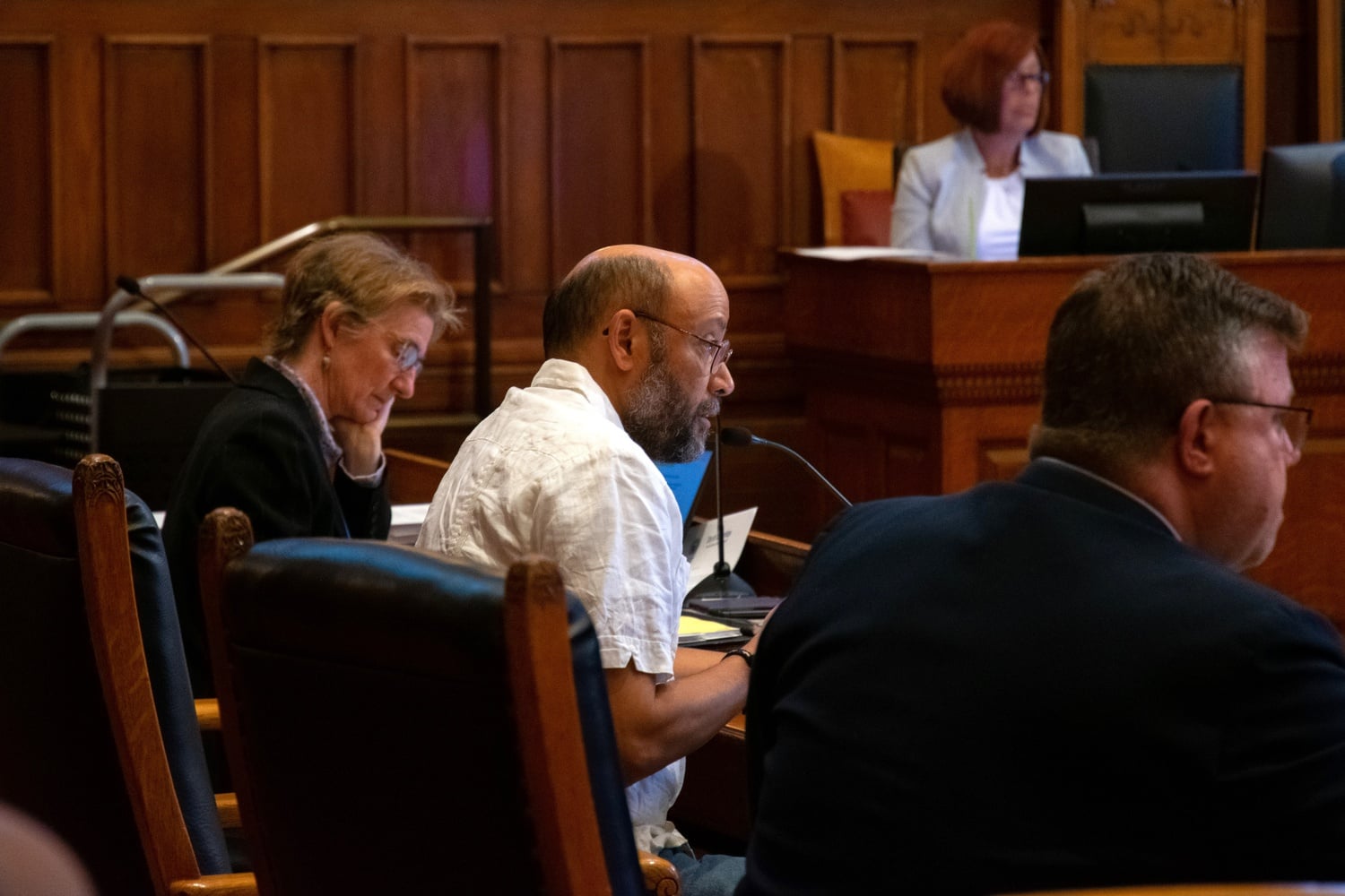 Quinton Y. Zondervan, pictured middle, speaks at a May 2023 meeting of the Cambridge City Council.
