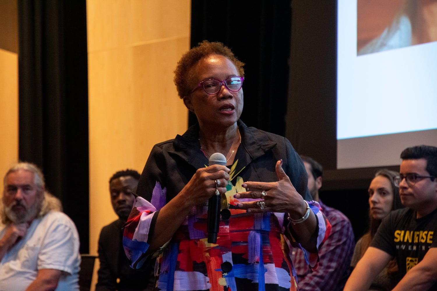 "I always saw myself as a little bit of a hybrid," Simmons says. Above, Simmons speaks at a candidate forum in September 2023 ahead of the Cambridge City Council election.