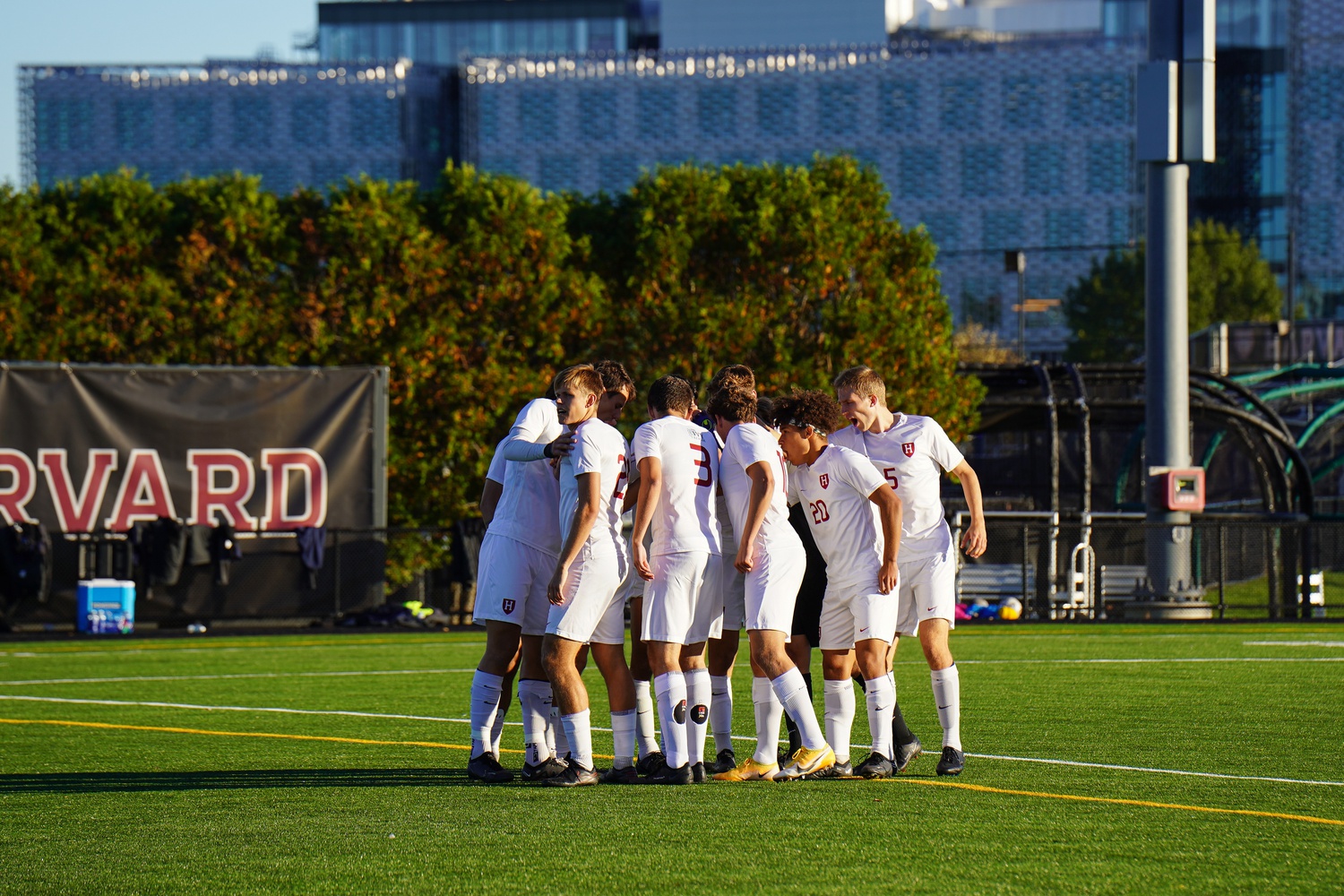 Harvard men’s soccer huddles up at an Oct. 8 game against Columbia in 2022, where it tied with the Lions 1-1. The Crimson will next take on Vermont this Saturday at 5:00 PM on Jordan Field.