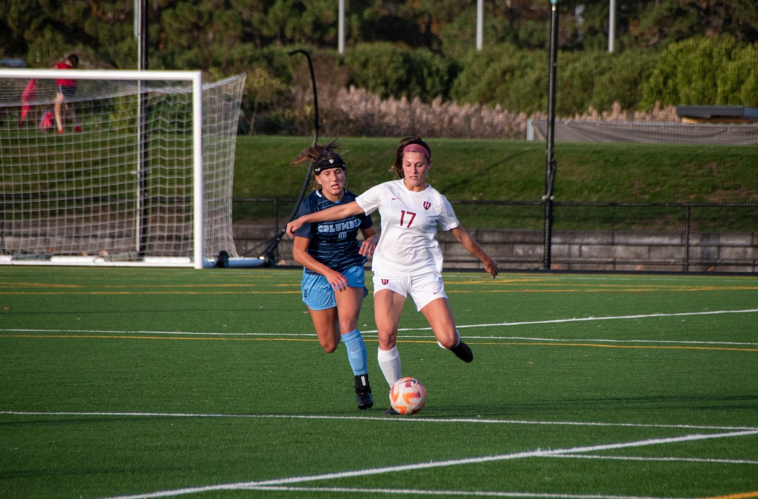 Then-junior defender Taylor Fasnacht drives the ball out of the defensive zone during Harvard's Nov. 5 game against Columbia in 2022, where the Crimson defeated the Lions 5-0.