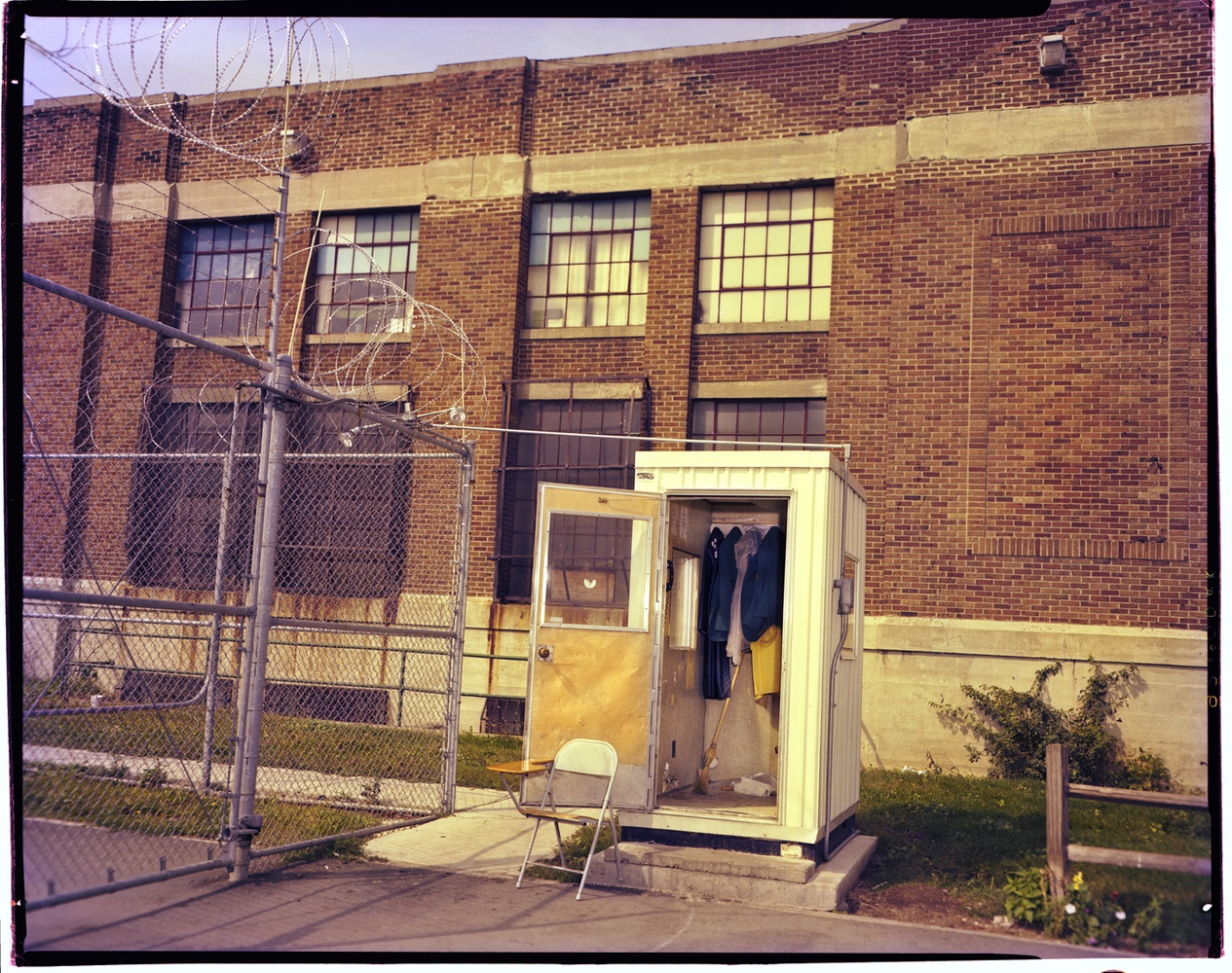 Barbed wire and a guard post on the outside of Walpole Prison. The facility was built in the early 1950s.