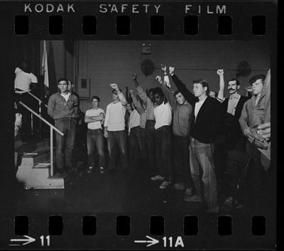 Cover image for Prisoners at Walpole raised their fists in solidarity at a 1971 rally for better conditions.